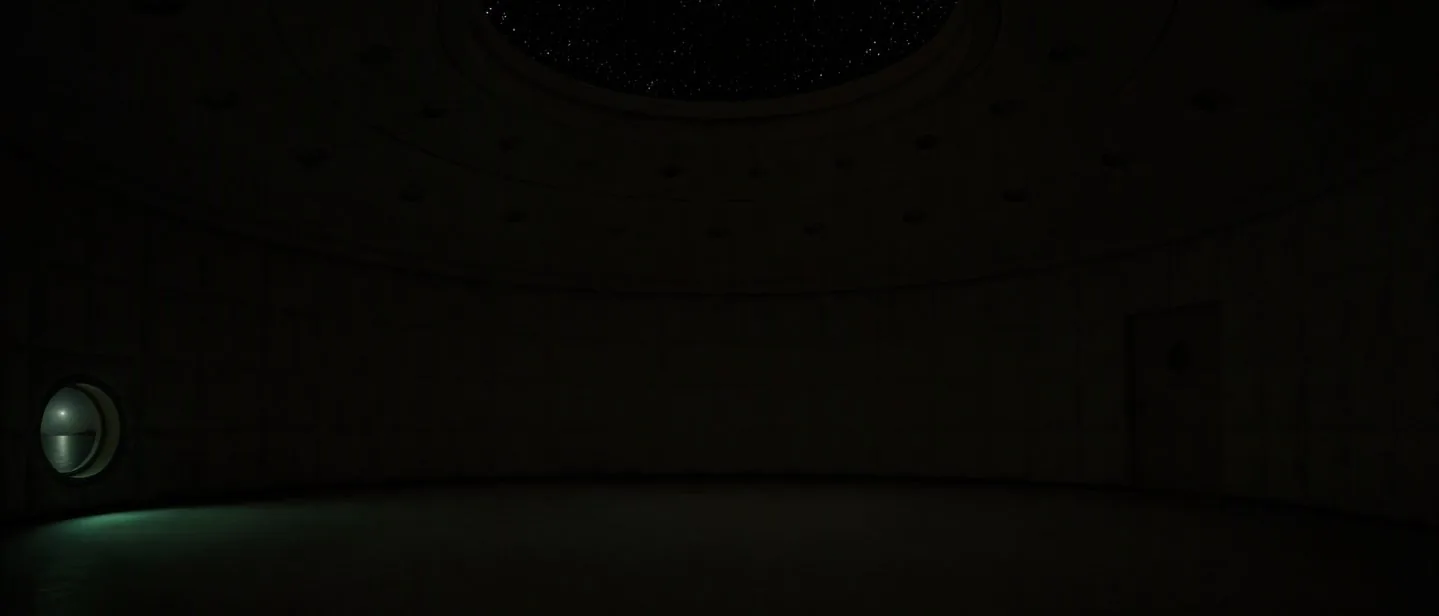 The room at true night, almost black, a star field visible in the oculus and a faint green glow from the pond window